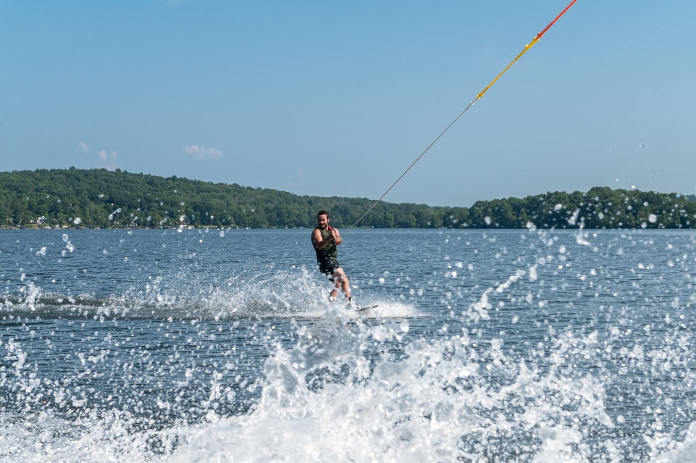 Waterskiier carving across a Connecticut lake